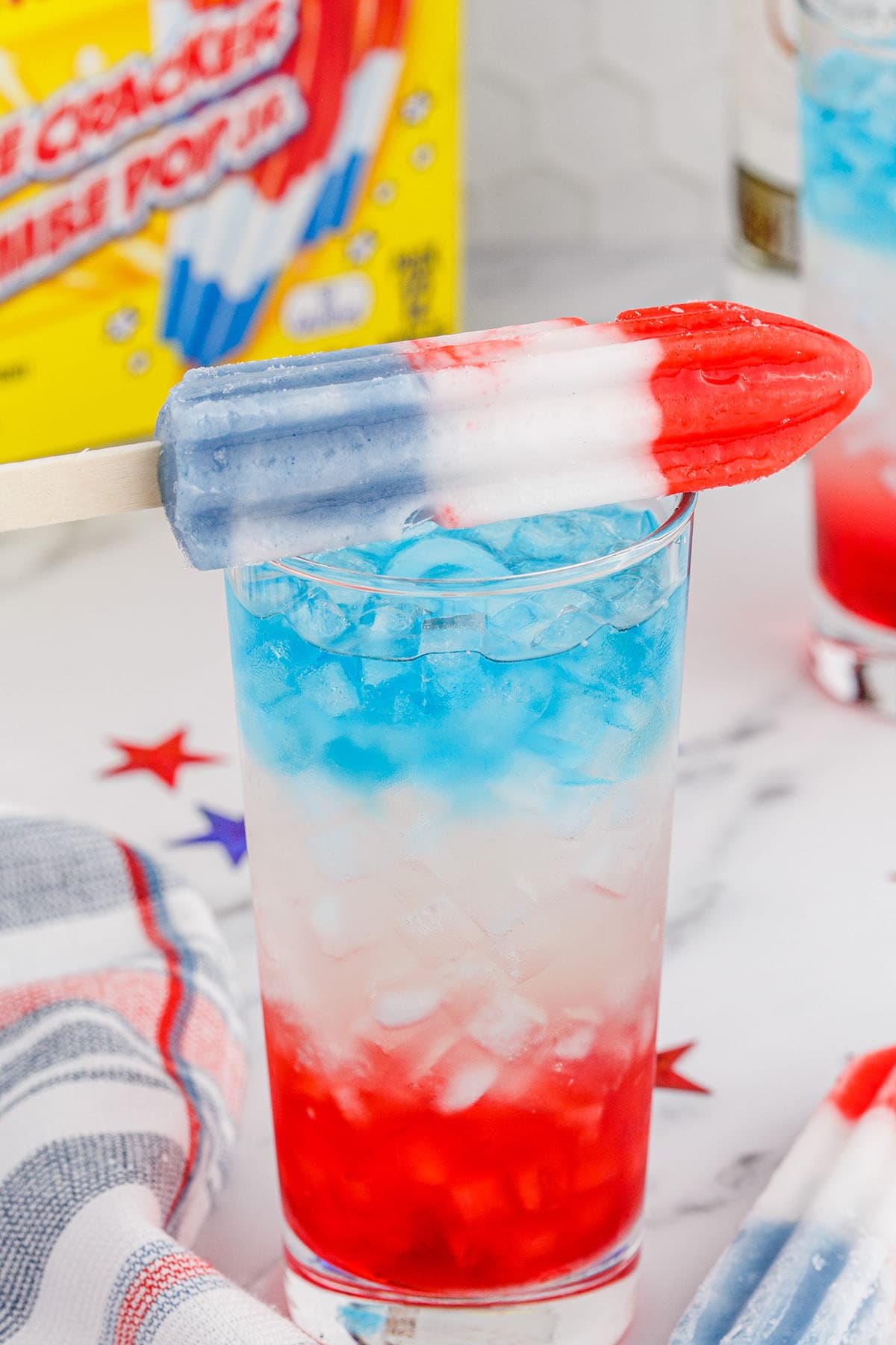 bomb pop cocktail with pop stick on top