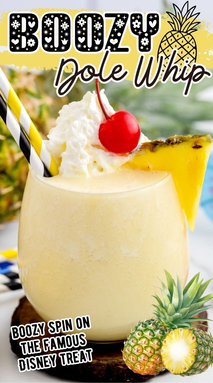 Boozy Dole Whip garnished with cherry and pineapple slice in a glass.