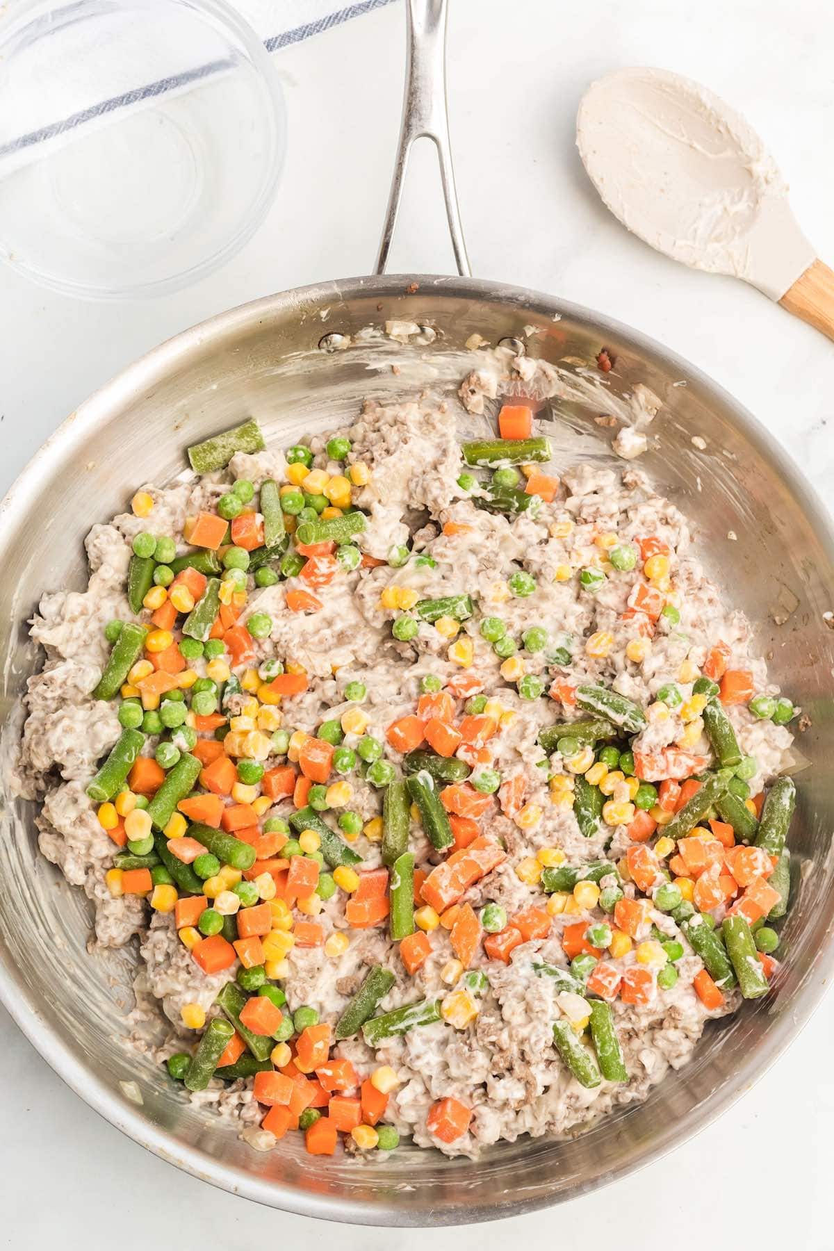 tater tot casserole mixture in a pan