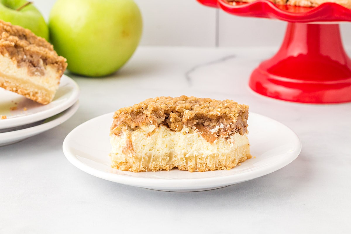 Apple Crumble Cheesecake Bars on a plate