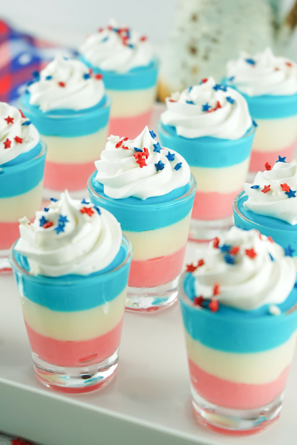 Red White and Blue Cheesecake Pudding Shots on a tray