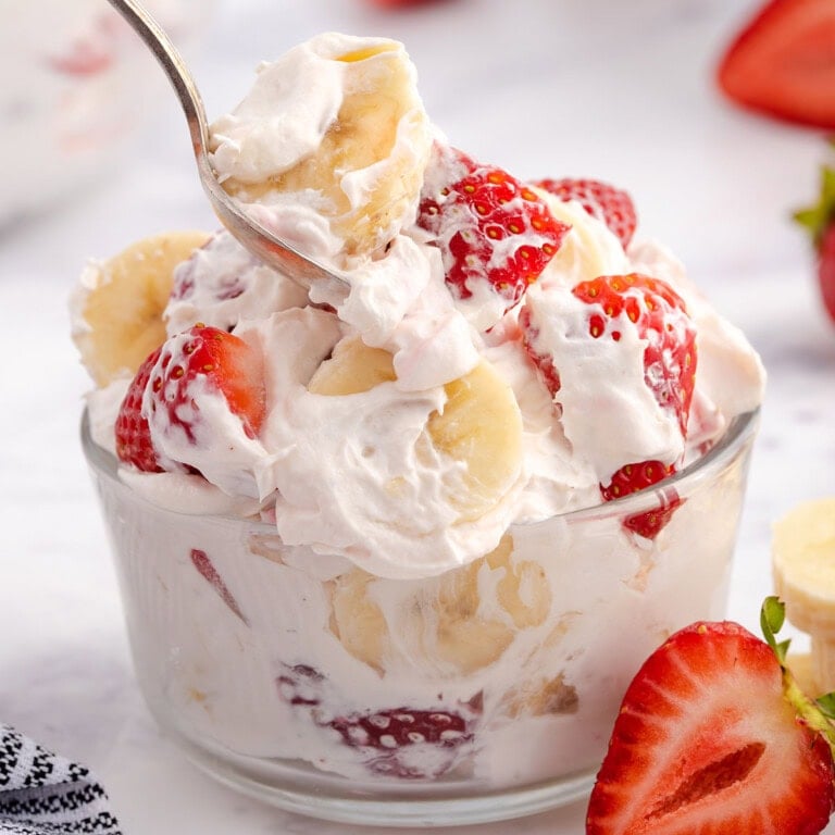 strawberry banana cheesecake salad in a bowl.