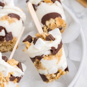 layered smores pop on top of ice cubes.