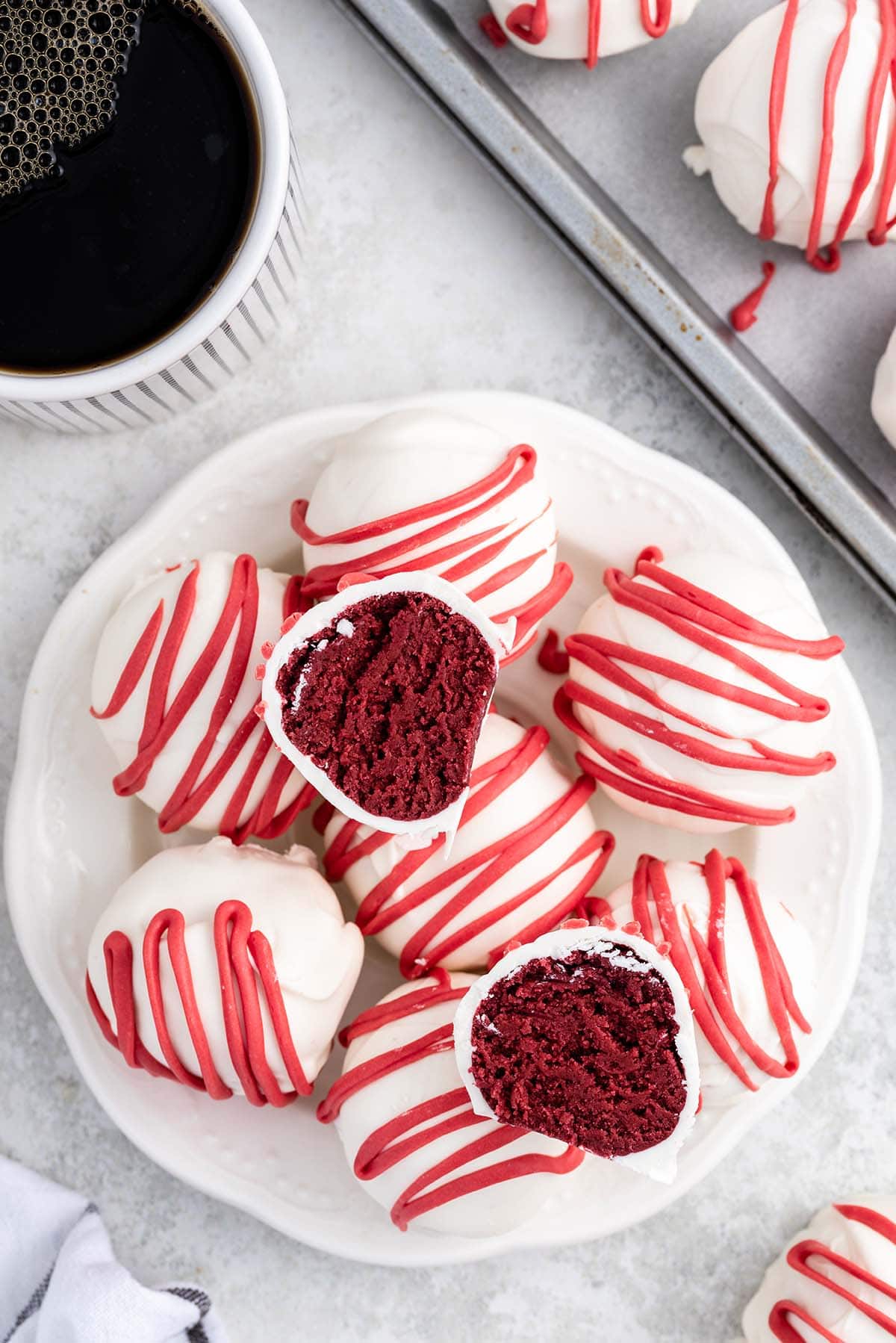 Red Velvet Cheesecake Bites stacked on a plate