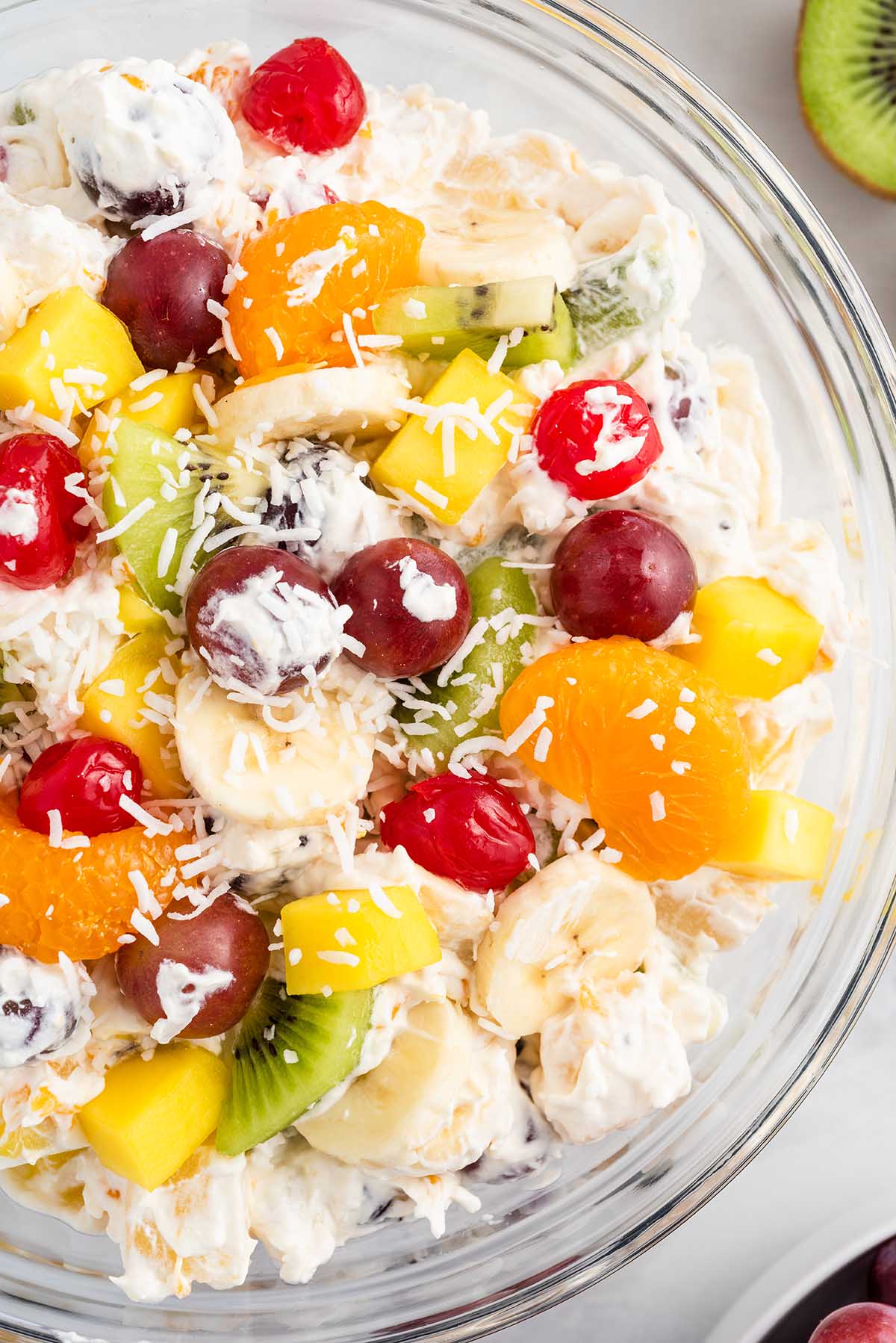 tropical cheesecake fruit salad in a bowl