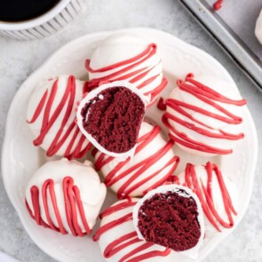 Red Velvet Cheesecake Bites stacked on a plate