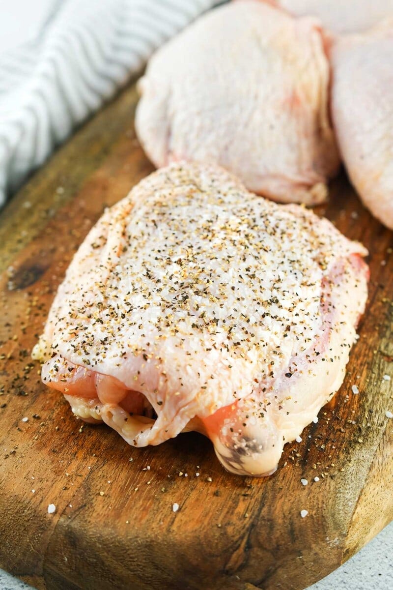 seasoning the chicken thighs