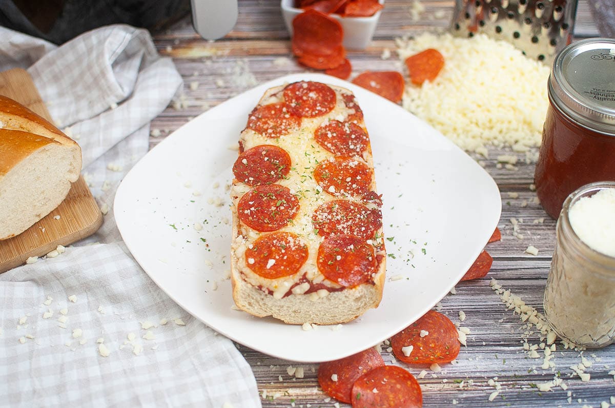 Air Fryer French Bread Pizza on top of a plate