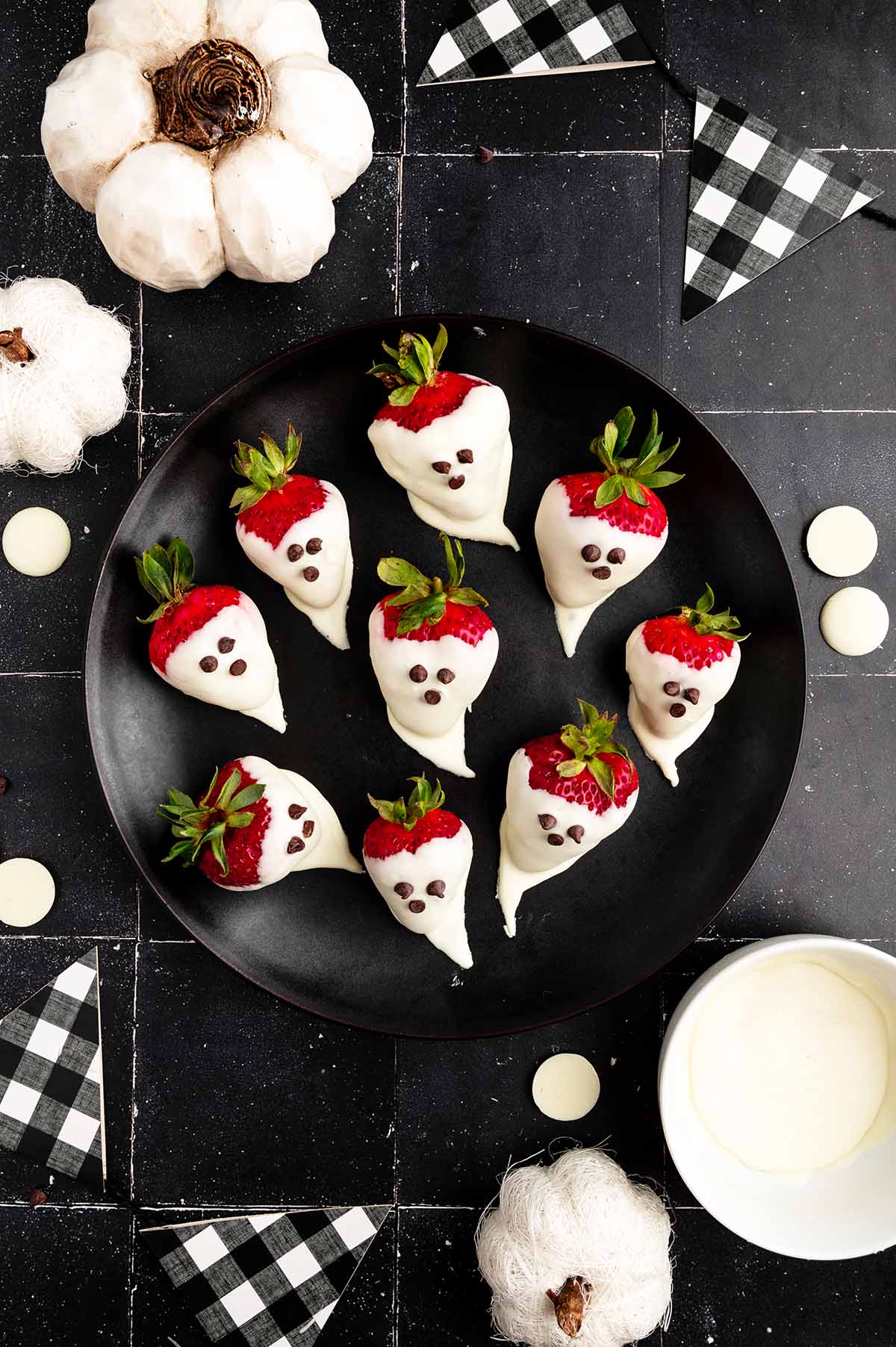 Spooky Ghost Strawberries on a plate