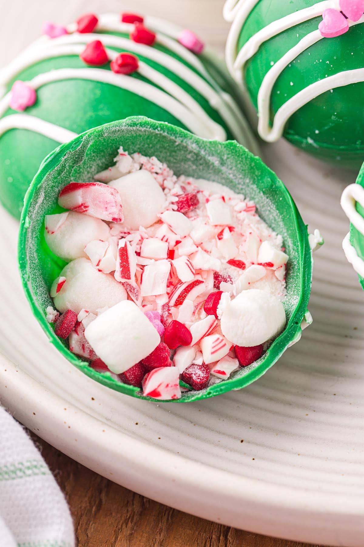 Grinch Bombs with marshmallow and heart shaped candy inside