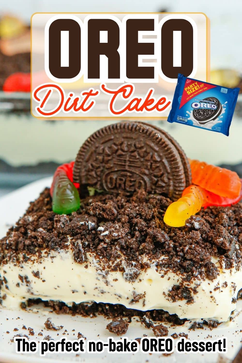 A slice of Oreo Dirt Cake decorated with gummy worms served on a white plate