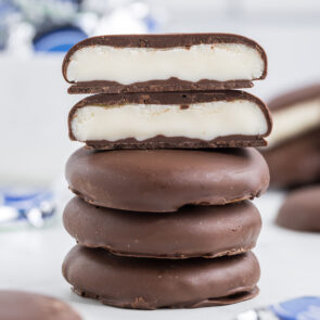 peppermint patties stacked on top of white table.