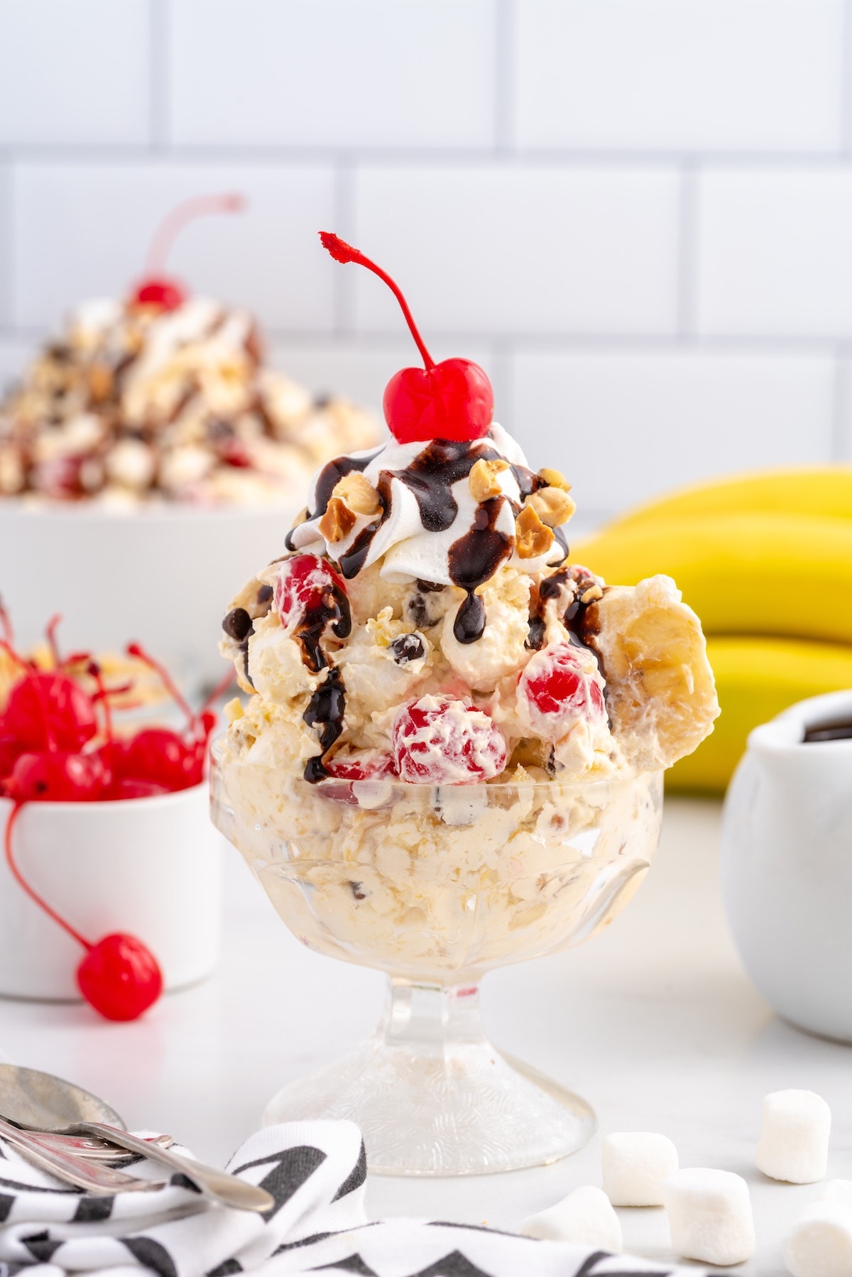 banana split fluff in a glass with on top