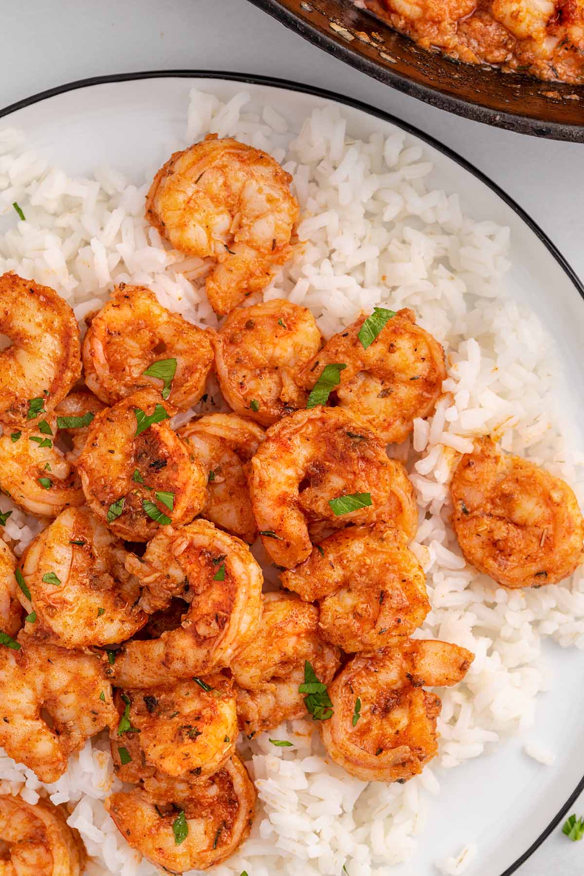 Cajun Shrimp in a large plate over rice