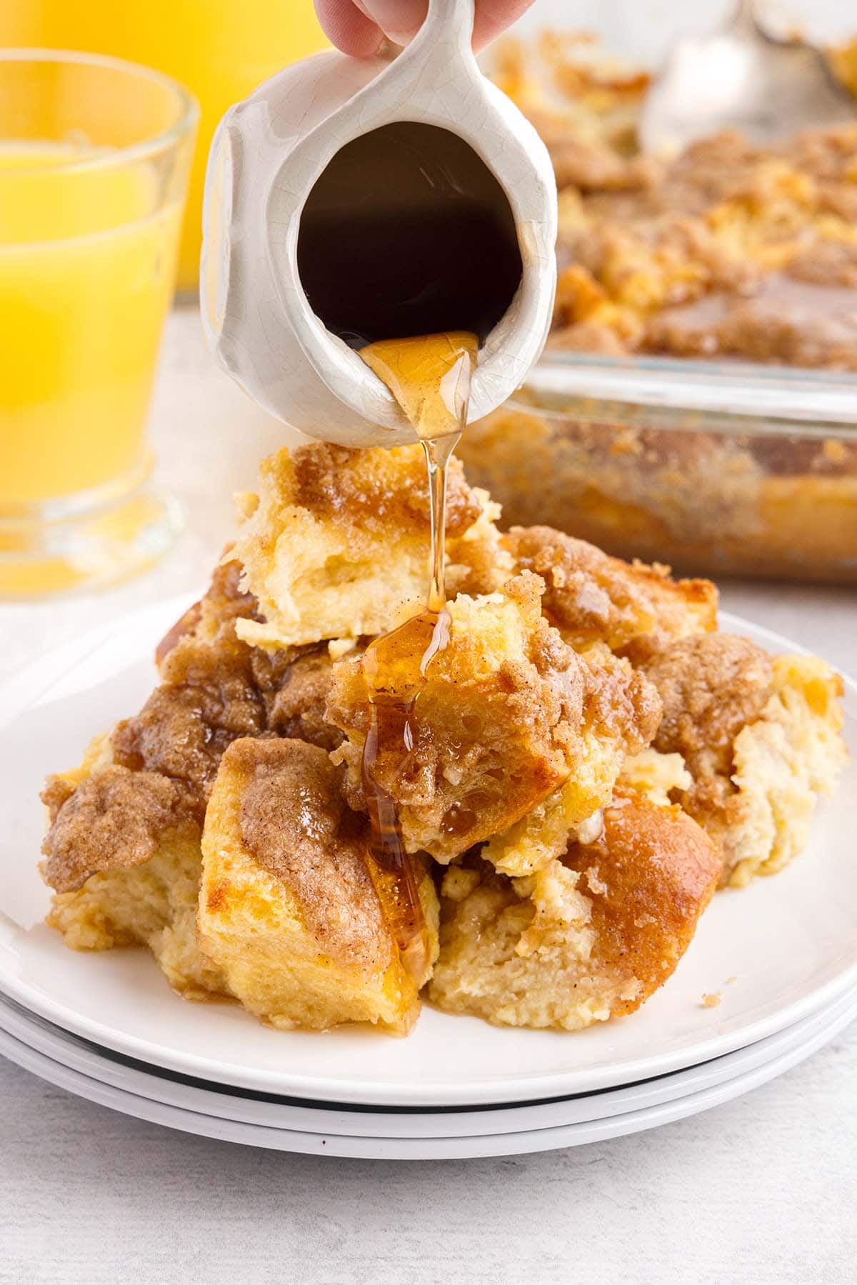 pouring honey on Overnight French Toast