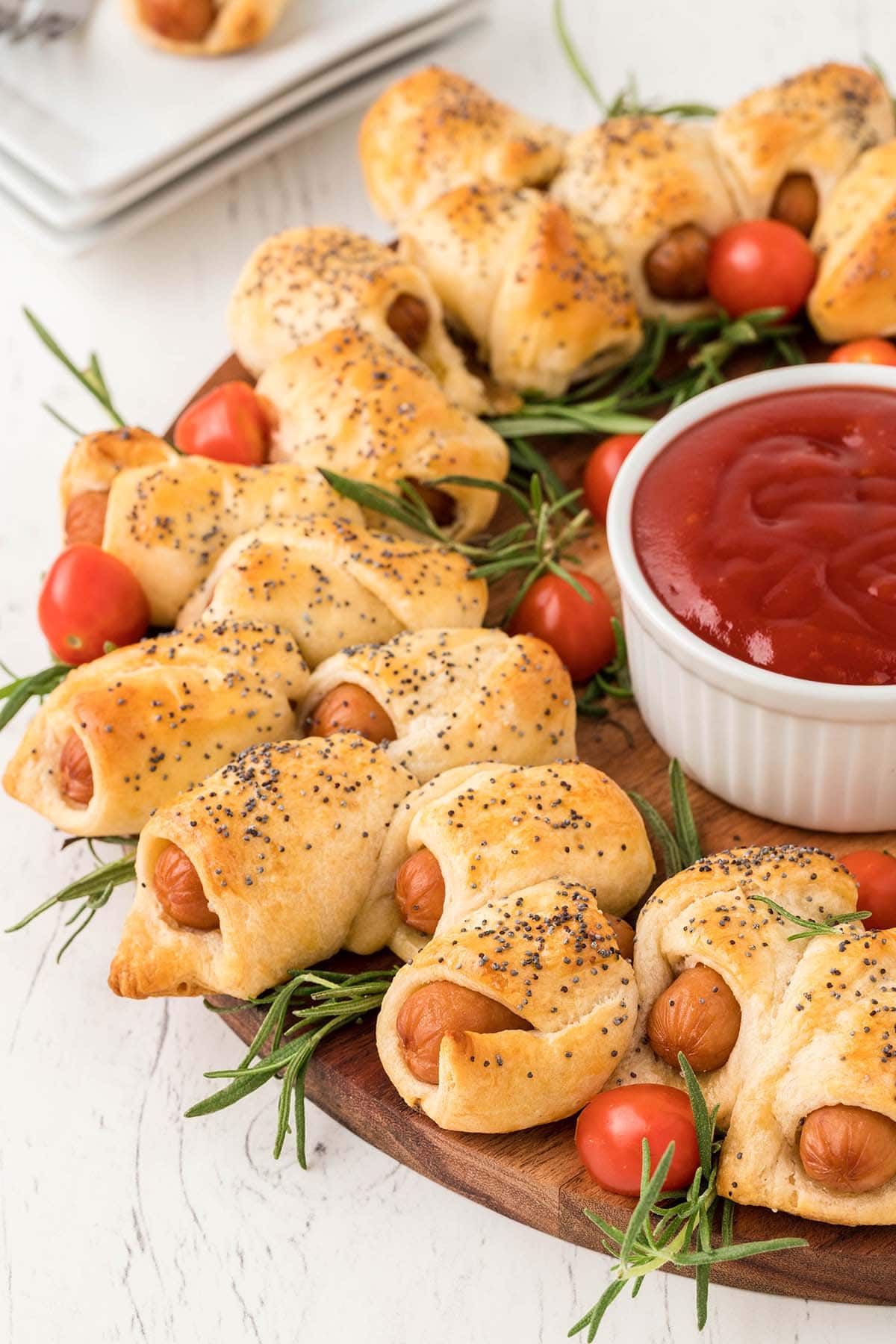Pigs in a Blanket Wreath with rosemary and tomato dip