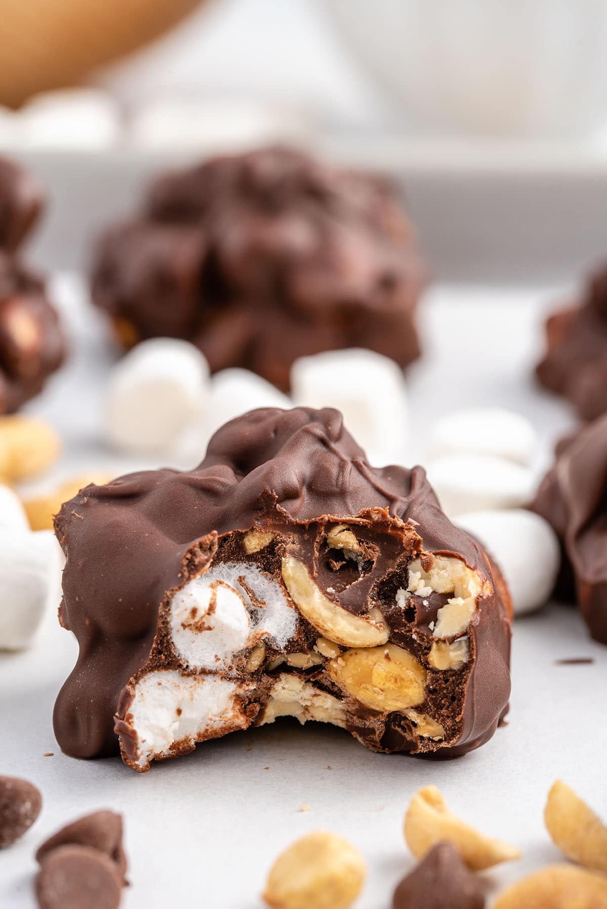 Close-up of a rocky road candy piece with a bite.