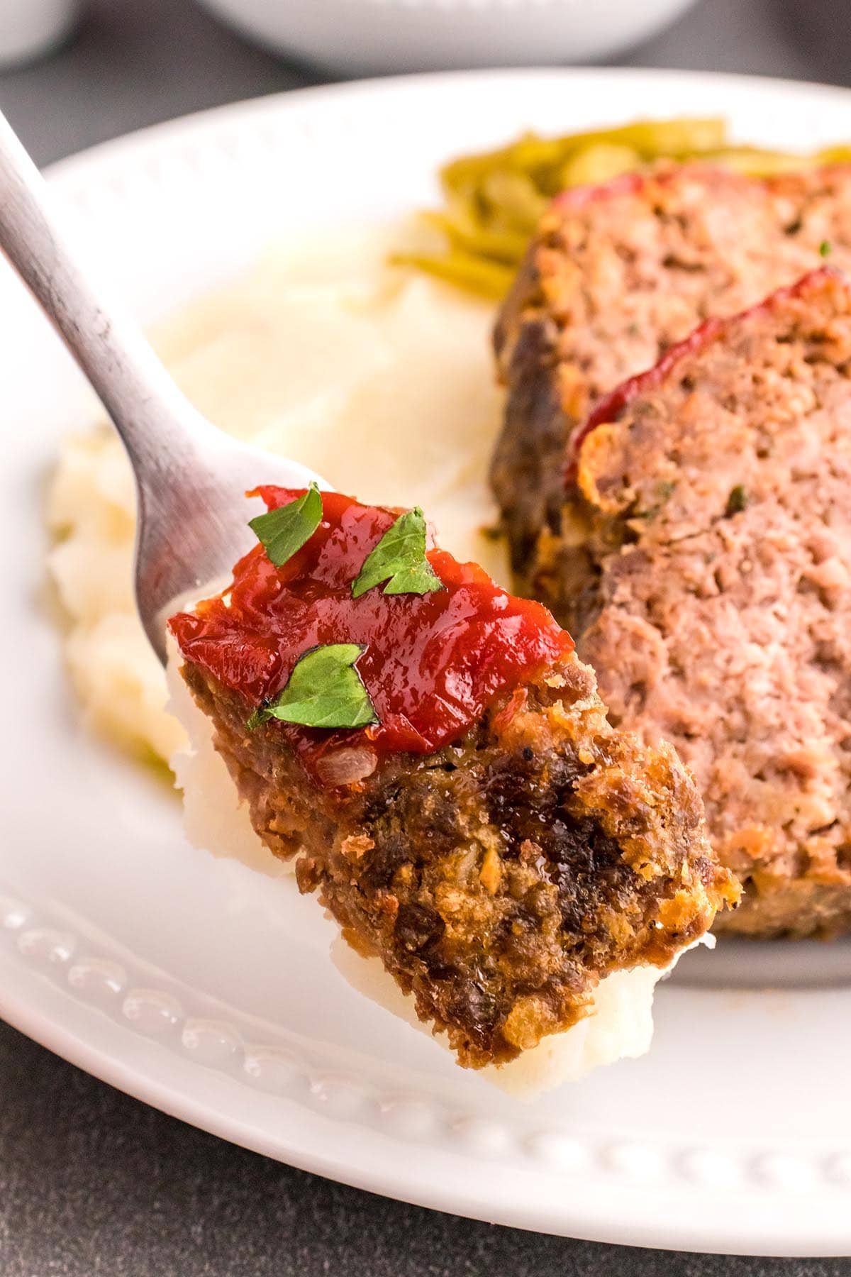 eating Meatloaf with ketchup