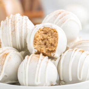 snickerdoodle truffles on a white plate.
