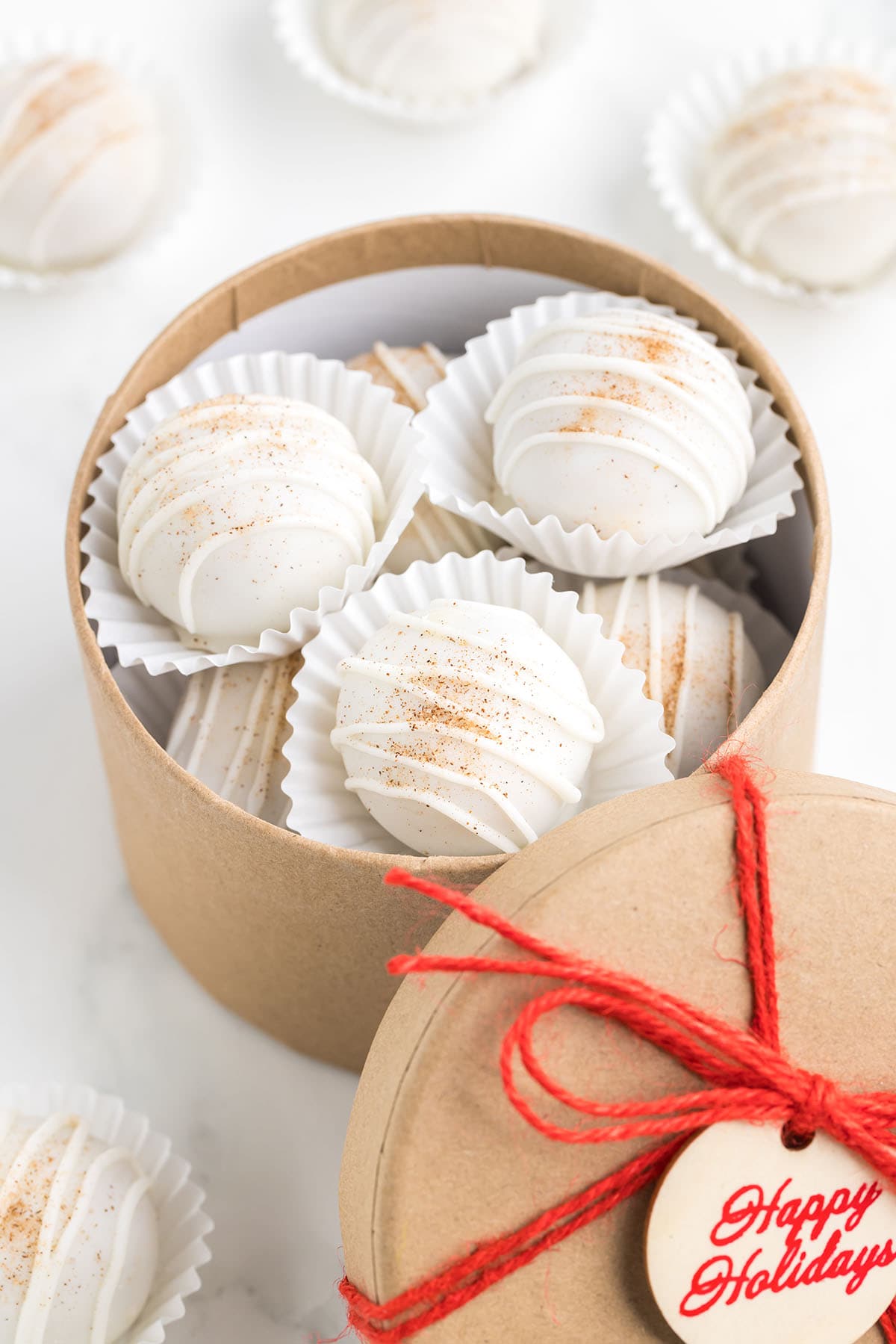 Snickerdoodle Truffles inside a holiday gift box.