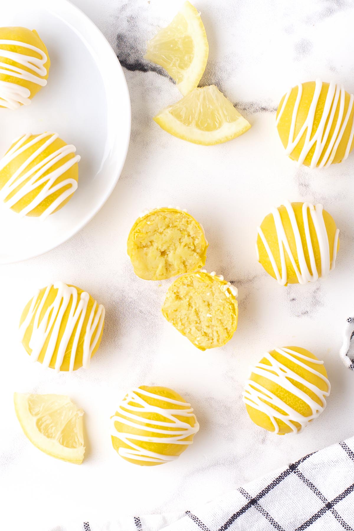 top shot of Lemon Cheesecake Bites Recipe with white drizzle