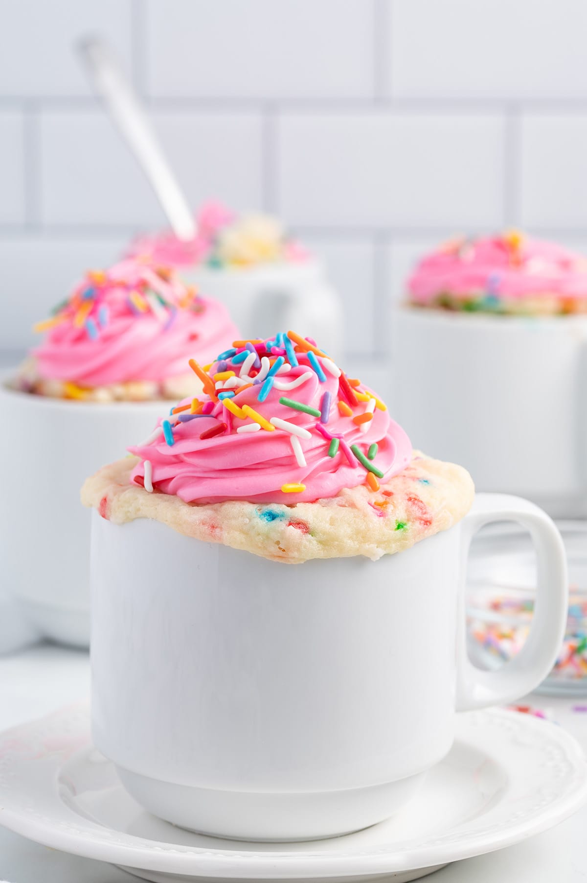 cupcake in a mug with pink frosting