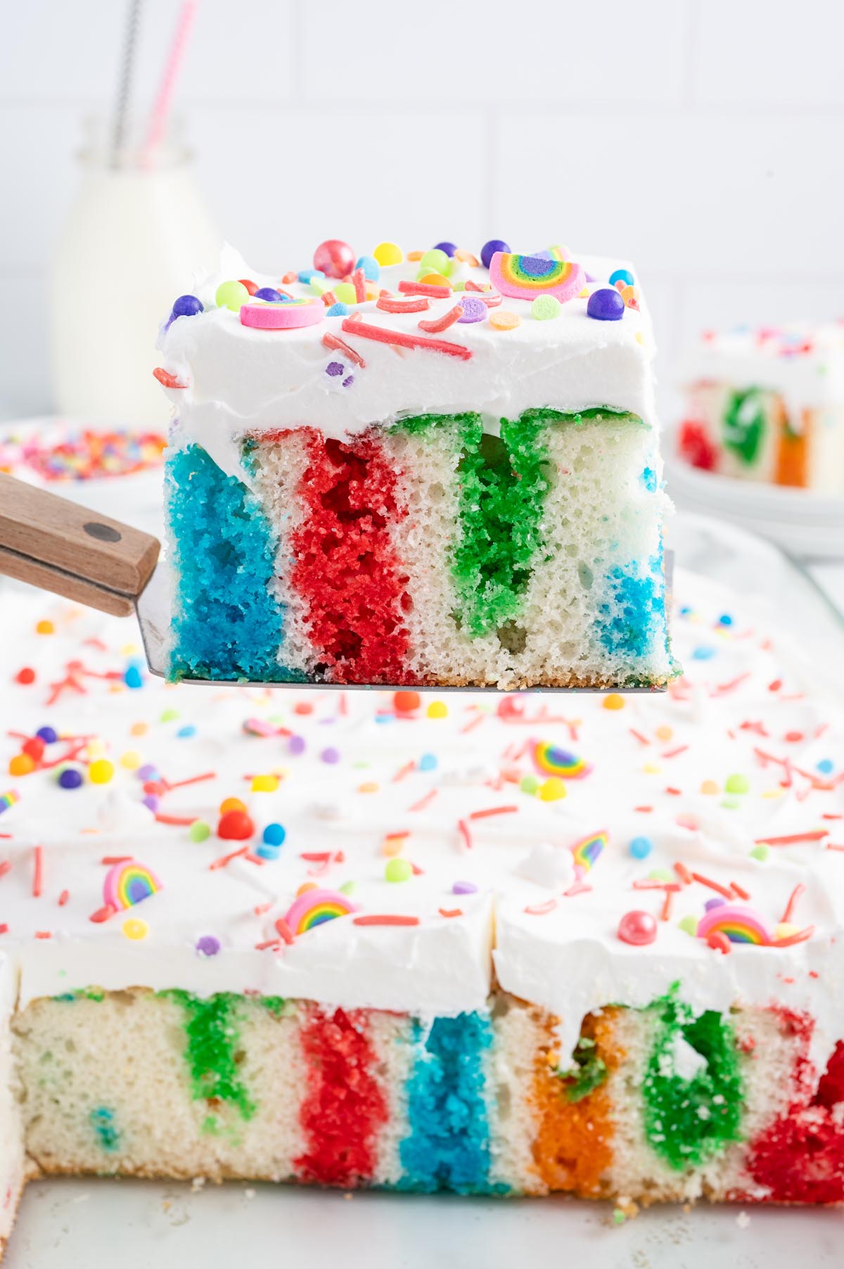 Rainbow Jello Cake on a spatula