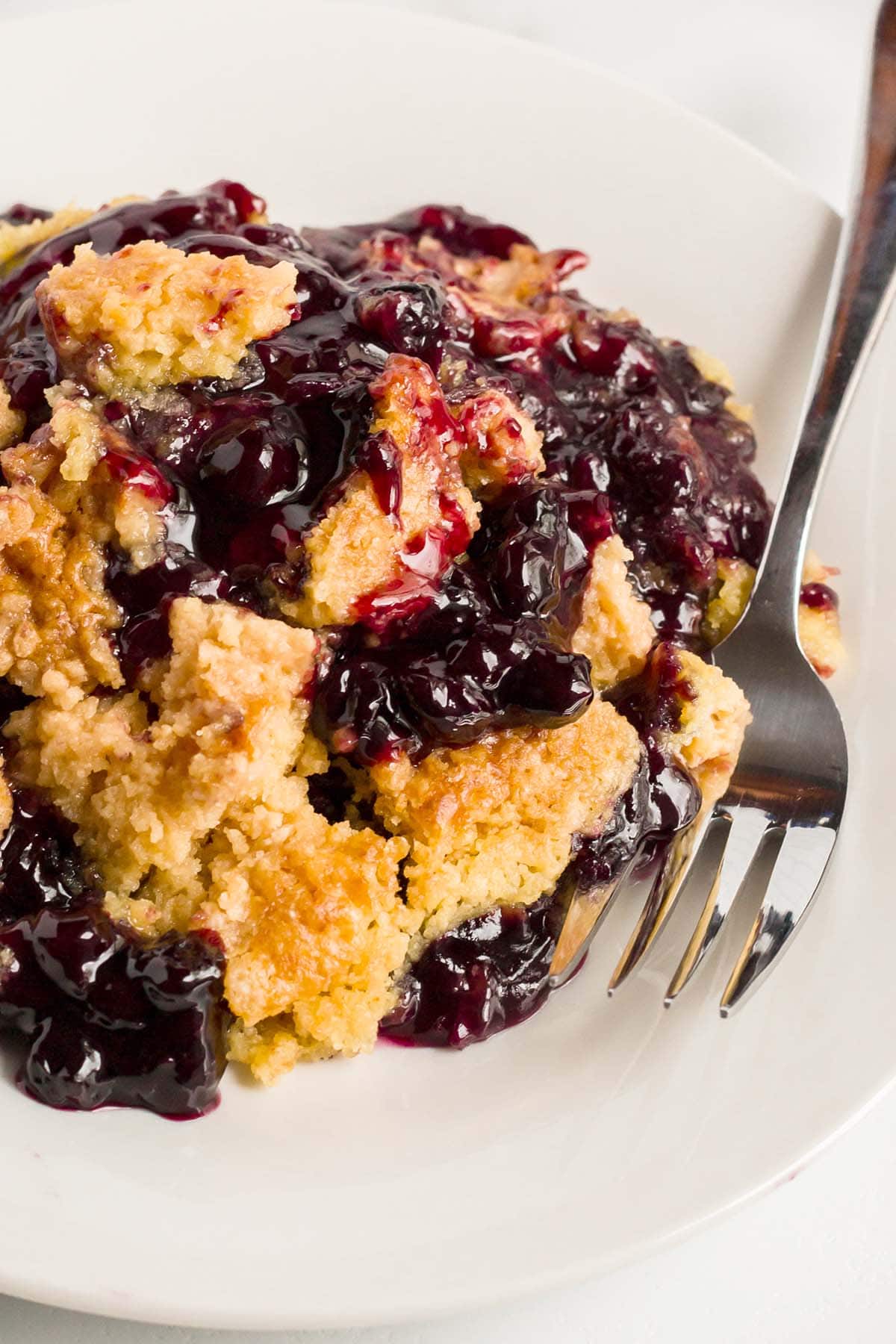 blueberry dump cake on a plate