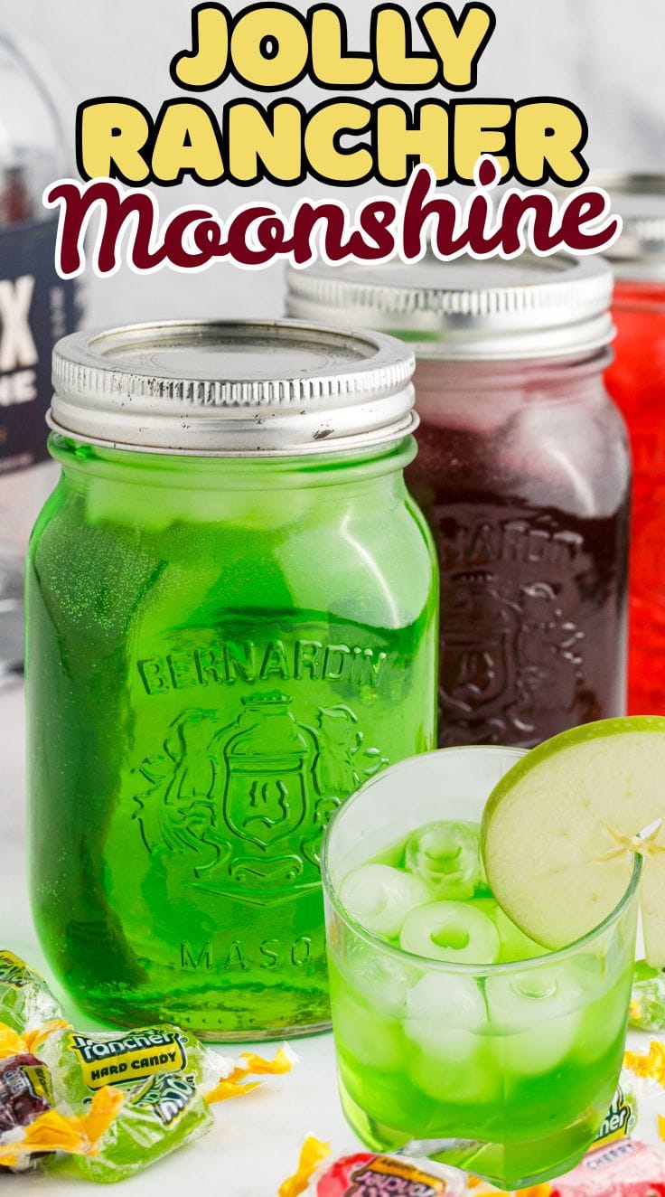 Green, purple and red Jolly Rancher Moonshine inside three mason jars.