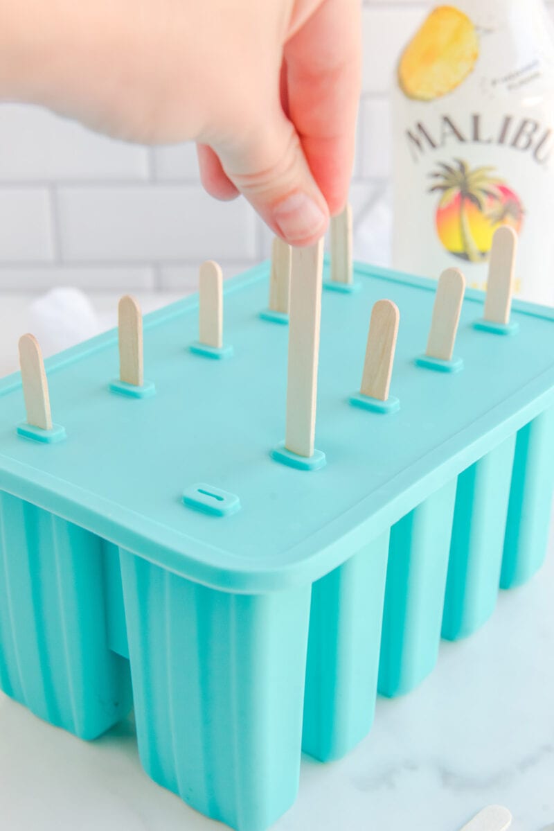 step 3 of Boozy Dole Whip Popsicles