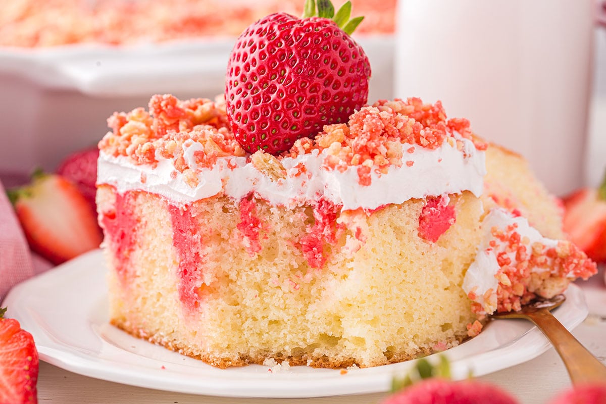 Strawberry Crunch Poke Cake on a plate