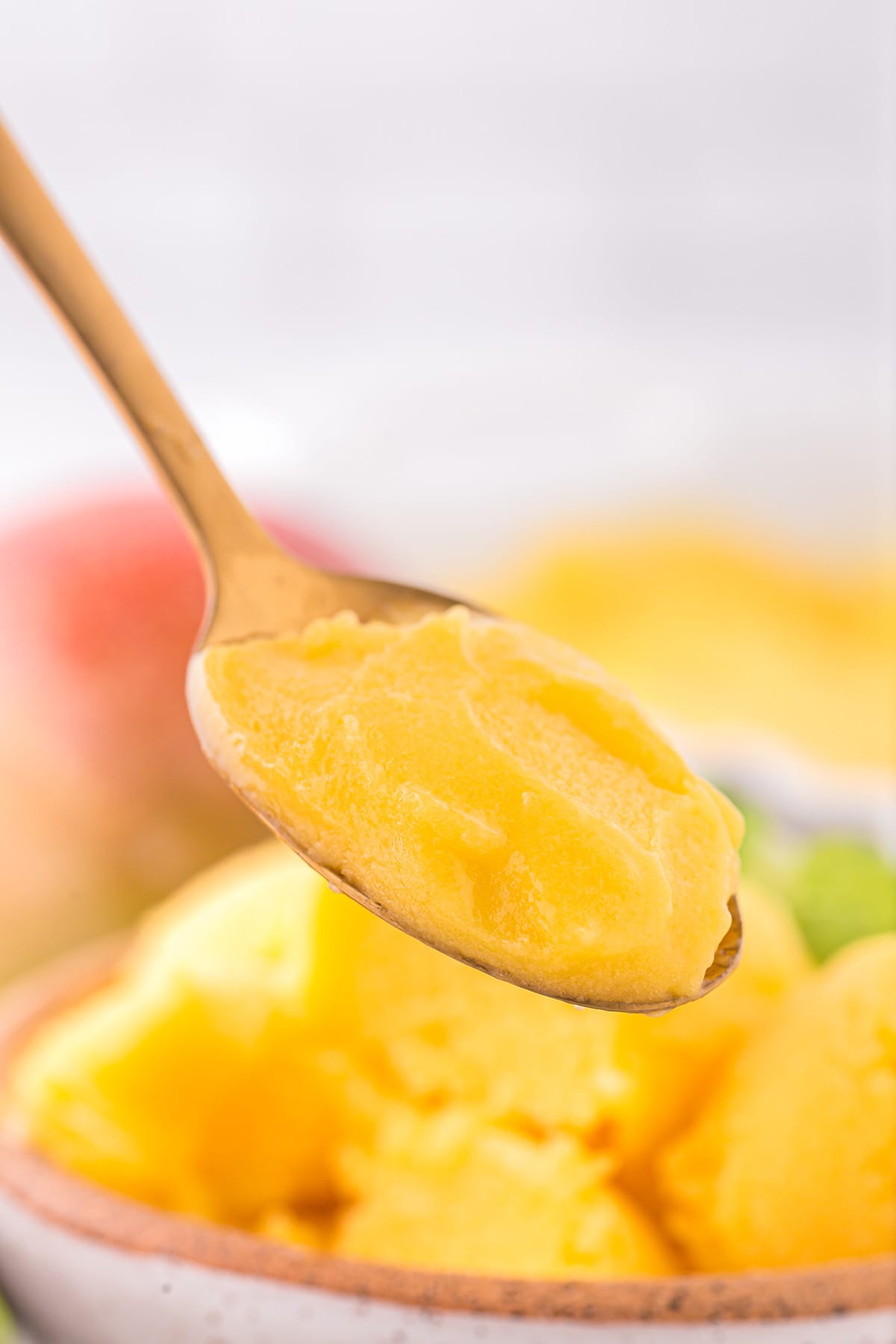 eating Mango Sorbet using a spoon