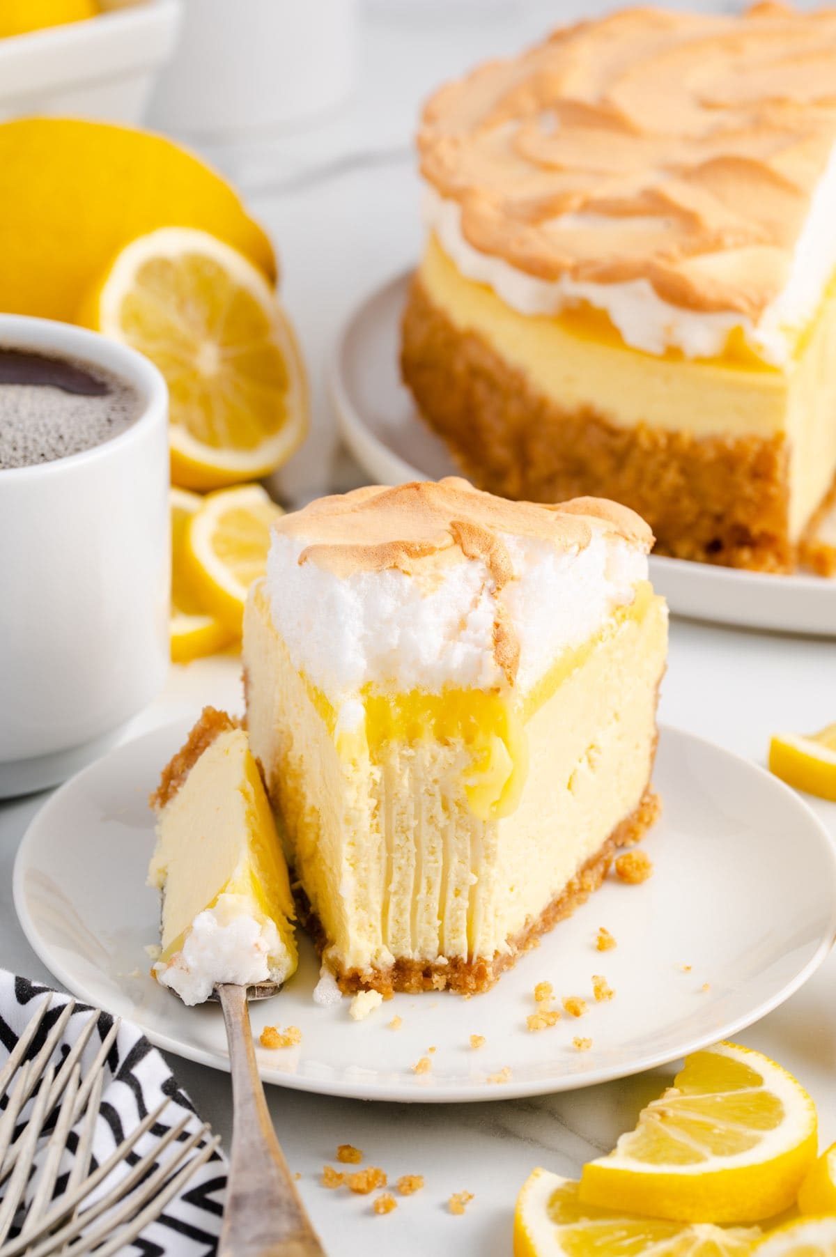 Lemon Meringue Cheesecake on a plate with fork