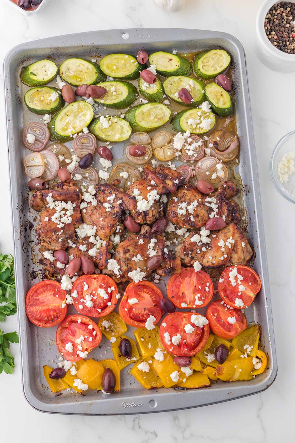 Greek Sheet Pan Chicken Dinner on a white table