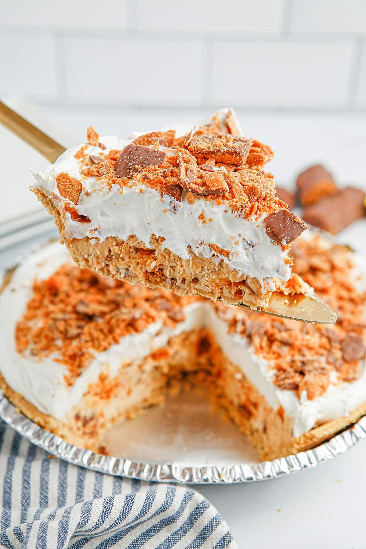 serving a slice of Butterfinger Pie