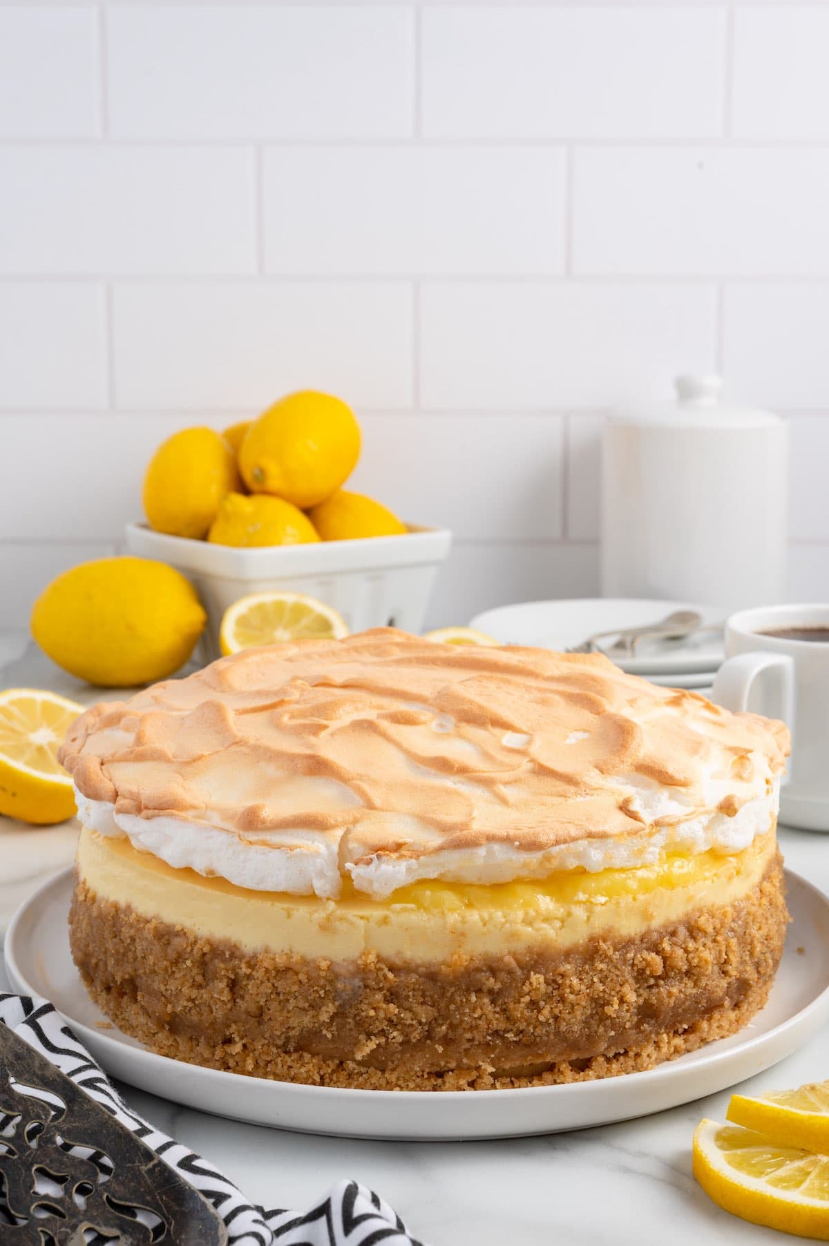 lemon meringue cheesecake on white table