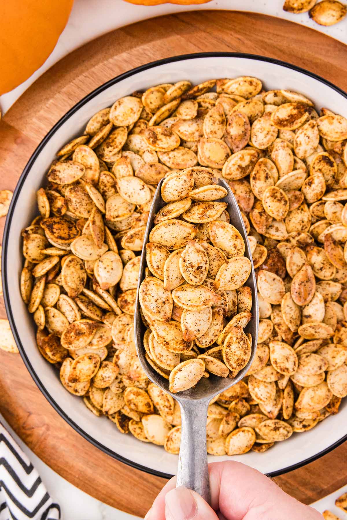 air fryer pumpkin seeds served in a big white bowl. 