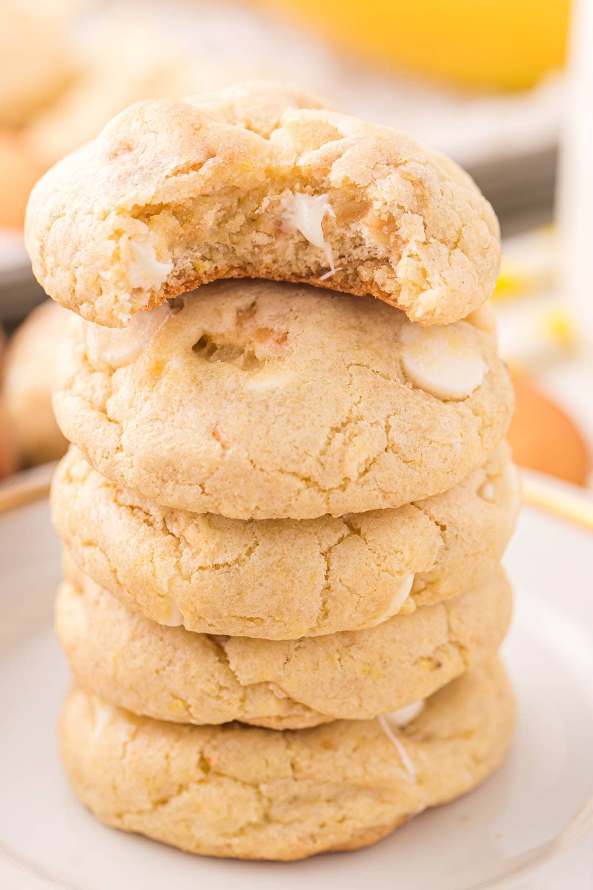 a couple of Banana Pudding Cookies stacked on a plate.