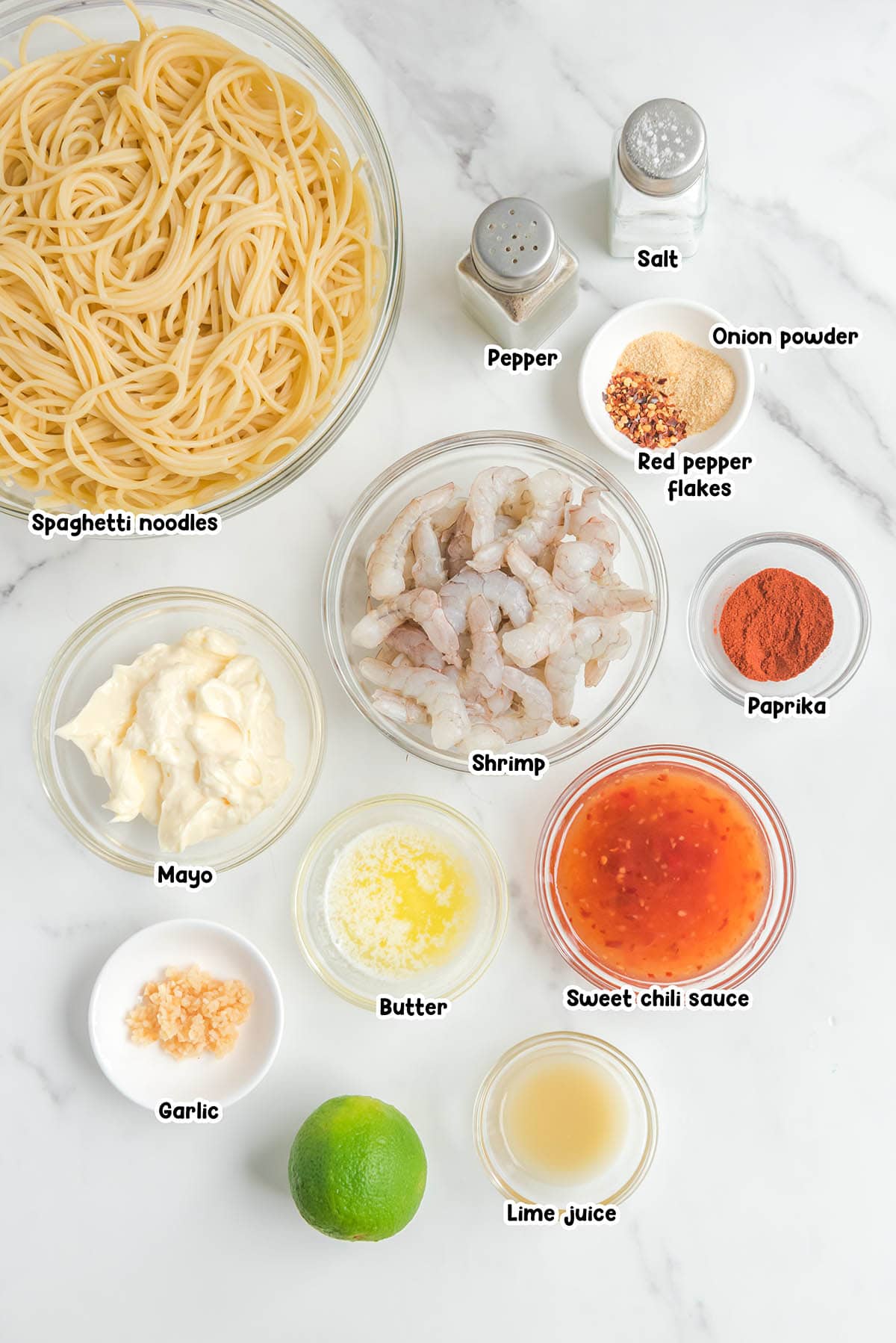 Bang Bang Shrimp Pasta ingredients - spaghetti noodles, red pepper flakes, mayo, shrimp, paprika, garlic, butter, sweet chili sauce, lime juice.