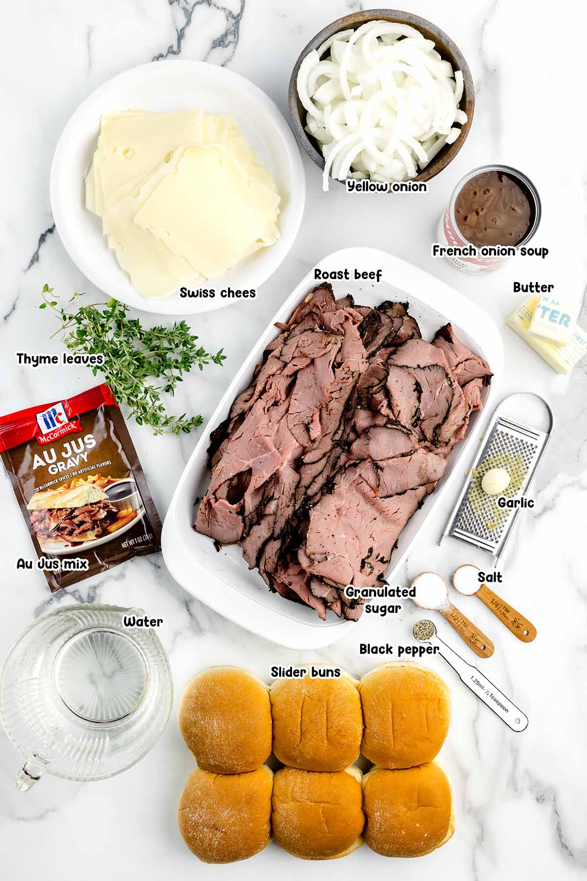 French Dip Sliders ingredients - inion, swiss cheese, french onion soup, butter, roast beef, au jus gravy packet, garlic, salt, sugar, water, thyme, pepper, slider buns.