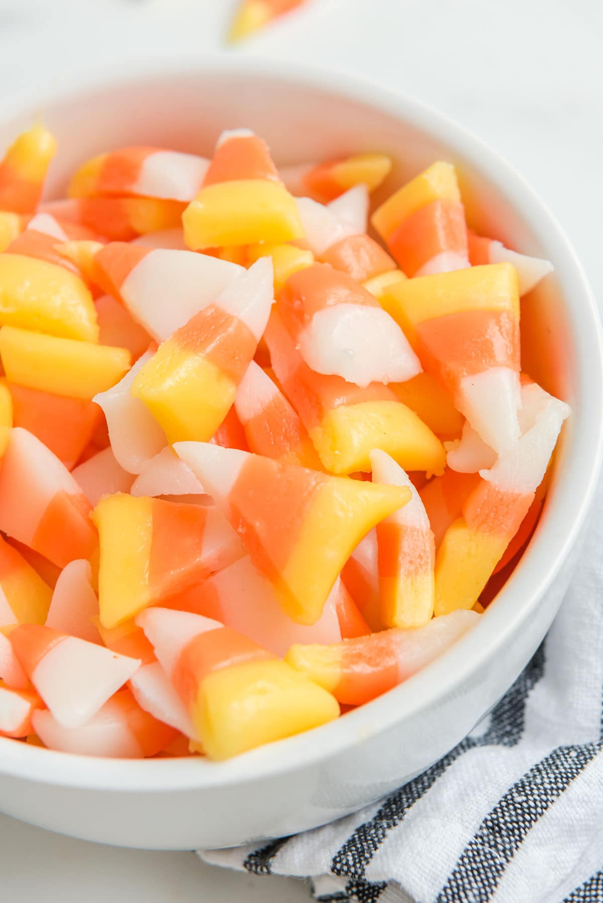 candy corn in a white bowl.