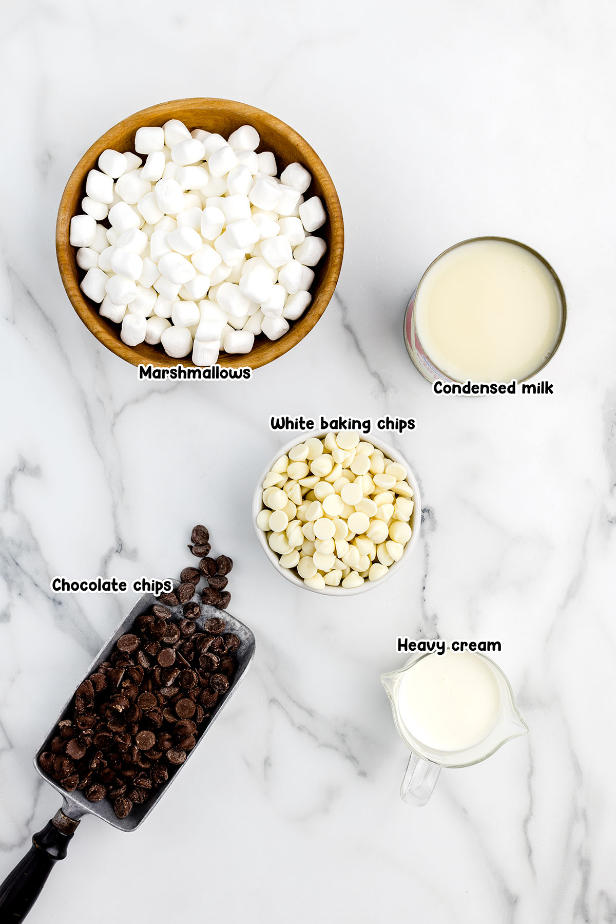 Hot Chocolate Fudge ingredients - marshmallows, condensed milk, white baking chips, chocolate chips and heavy cream.