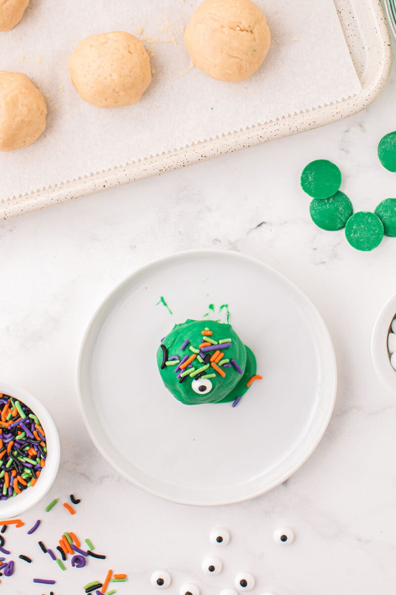 decorate the oreo balls with sprinkles and candy eye.