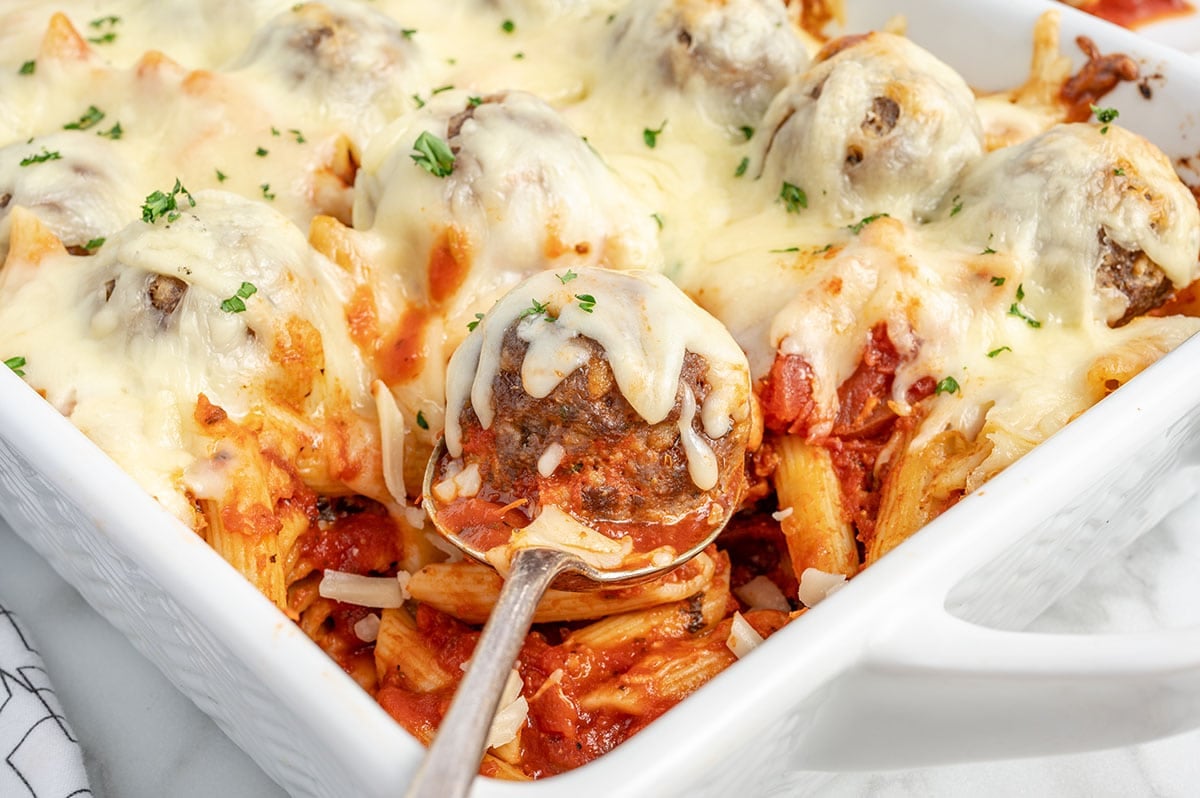 Meatball Casserole in a baking dish with penne pasta.