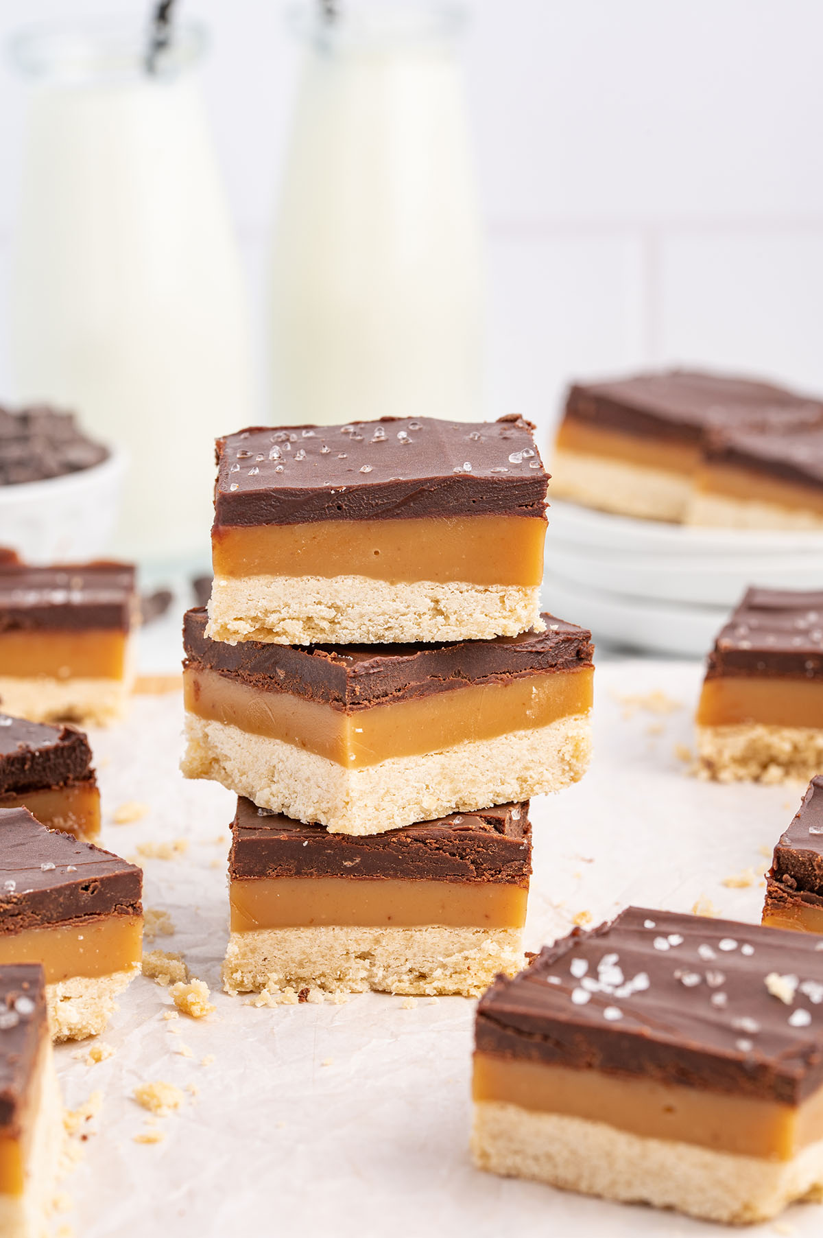 3 pieces of millionaire shortbread stacked on top of each other.
