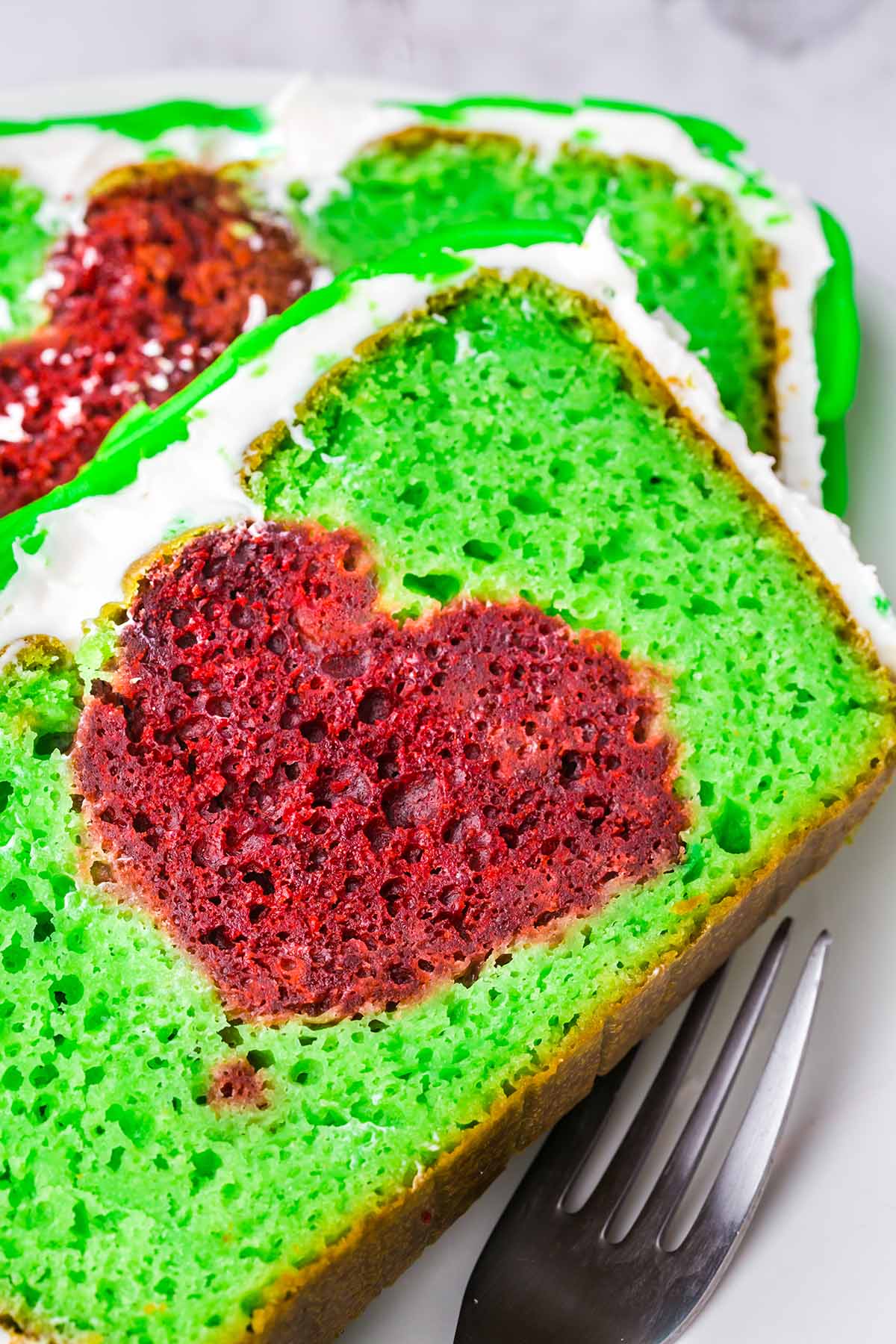 Grinch Cake with a hidden heart in the middle of the cake.