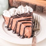 a slice of nutella pie on a white plate with a fork.