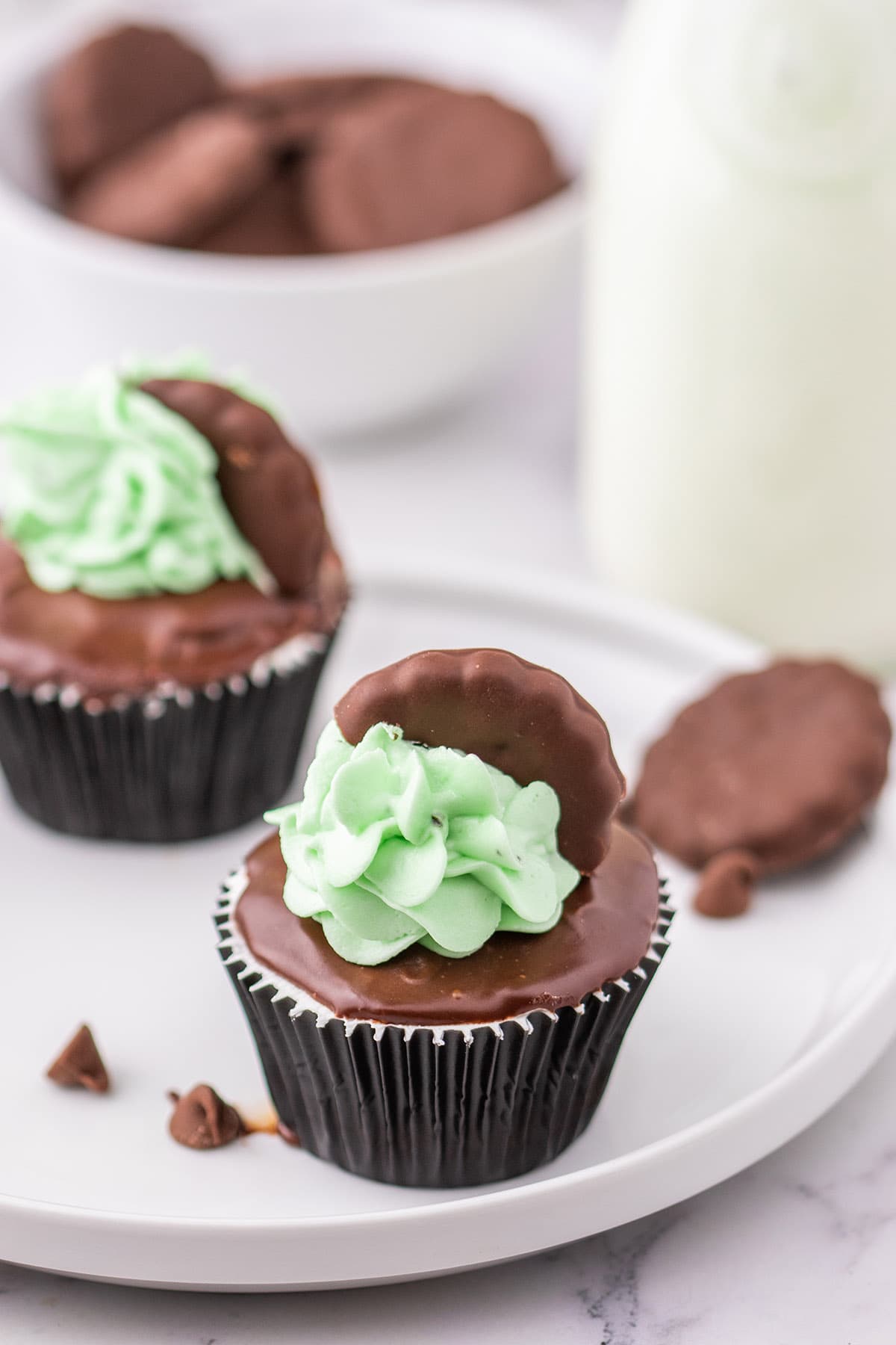 2 Thin Mint Cupcakes on a white plate.