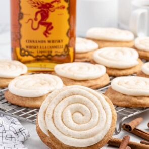 a couple of Fireball Cookies on a cooking rack and a fireball cinnamon whisky on the background.