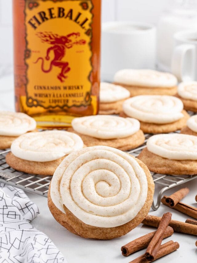 a couple of Fireball Cookies on a cooking rack and a fireball cinnamon whisky on the background.